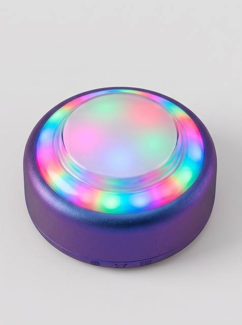 Puck, a round violet device with a frosted domed button and a glowing ring of colourful lights.